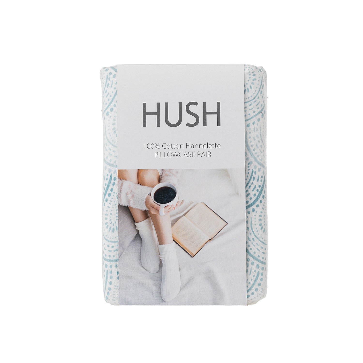 Hush pillowcases packaging with a person reading a book and drinking coffee on a white background