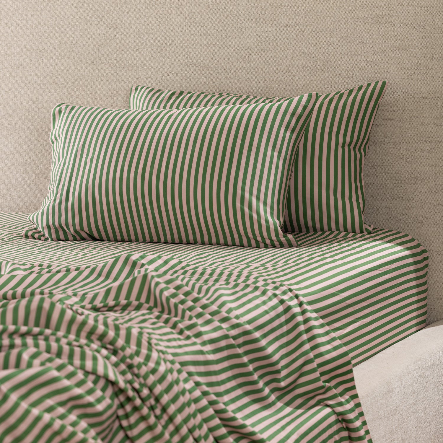 Marlo Mia Stripe fitted sheet styled on a bed with matching striped pillowcases, showcasing the coordinated stripe pattern.