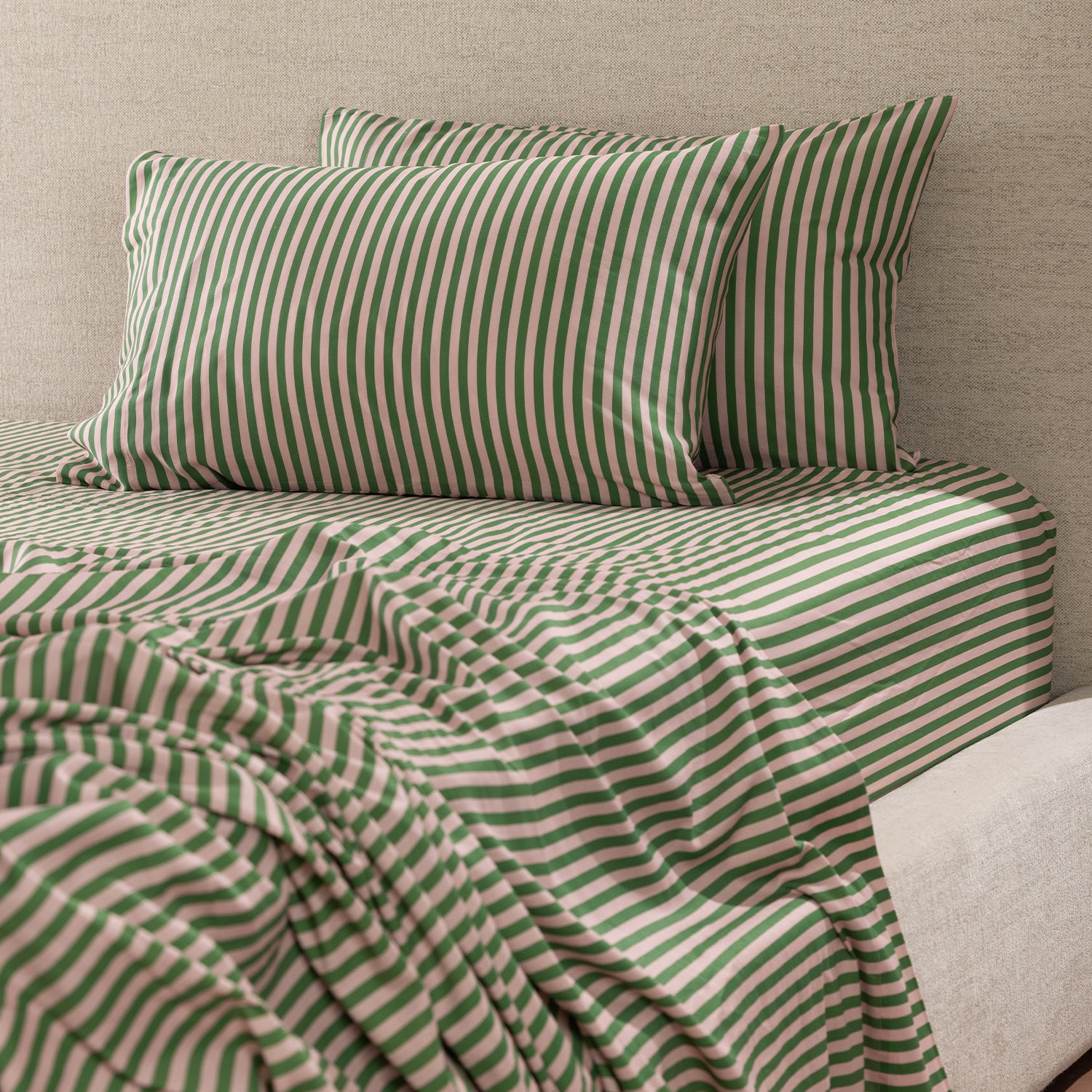 Marlo Mia Stripe Flat Sheet styled with matching striped pillowcases, highlighting the coordinated pink and green stripe design.