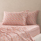 Two Marlo Mia floral print pillowcases styled on a bed with matching floral fitted sheet and coordinating bedding.