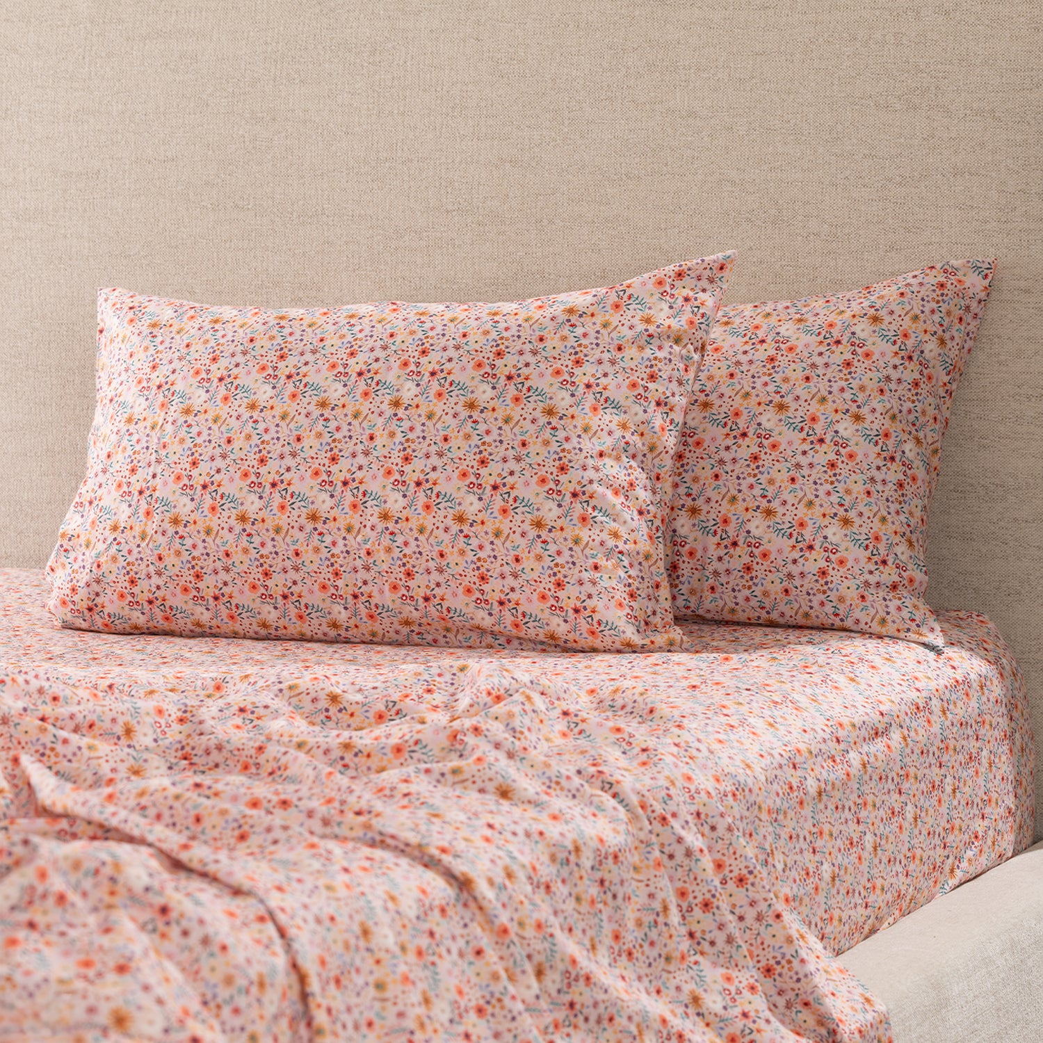Two Marlo Mia floral print pillowcases styled on a bed with matching floral fitted sheet and coordinating bedding.